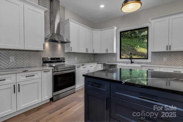 127 View Ridge Parkway, Leicester, NC 28748 - kitchen featuring appliances with stainless steel finishes, wall chimney exhaust hood, white cabinets, decorative backsplash, and recessed lighting