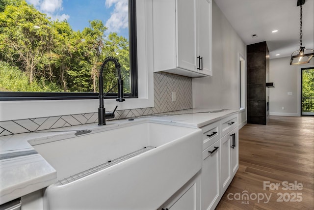 127 View Ridge Parkway, Leicester, NC 28748 - kitchen featuring backsplash, white cabinetry, recessed lighting, wood finished floors, and pendant lighting