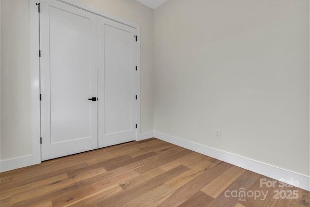 127 View Ridge Parkway, Leicester, NC 28748 - unfurnished bedroom featuring light wood-type flooring and a closet