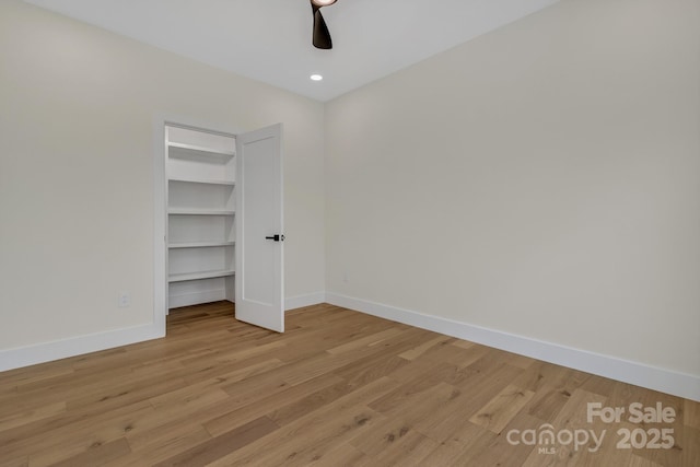 127 View Ridge Parkway, Leicester, NC 28748 - unfurnished bedroom with light wood finished floors, a spacious closet, a ceiling fan, recessed lighting, and a closet