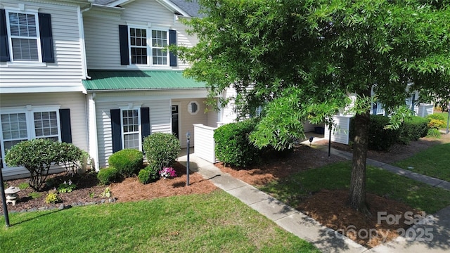 4151 Town Center Rd, Harrisburg, NC 28075 - view of front of house with metal roof, a front yard, and a porch