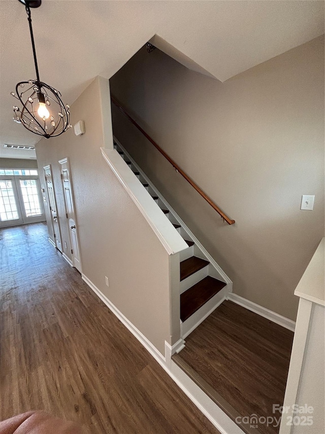 4151 Town Center Rd, Harrisburg, NC 28075 - staircase featuring wood finished floors and baseboards