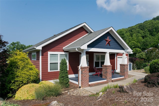 26 Byrdcliffe Ln, Asheville, NC 28805 - view of front of home featuring covered porch and a shingled roof