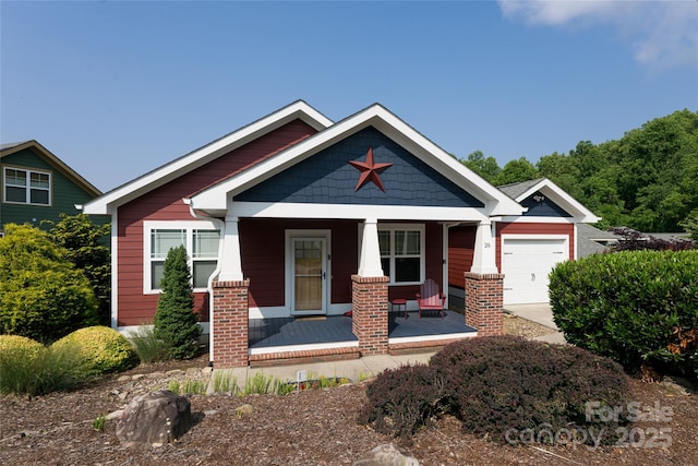 26 Byrdcliffe Ln, Asheville, NC 28805 - craftsman-style home with covered porch, a garage, and driveway