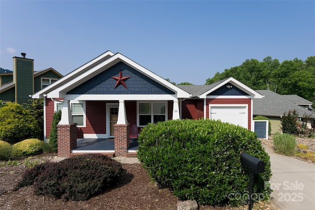26 Byrdcliffe Ln, Asheville, NC 28805 - view of front of house featuring a garage and covered porch