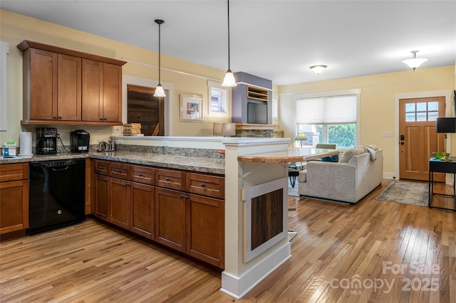 26 Byrdcliffe Ln, Asheville, NC 28805 - kitchen featuring black dishwasher, a peninsula, open floor plan, light wood-type flooring, and brown cabinetry