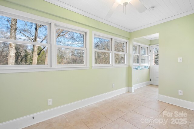 3515 Back Creek Church Rd, Charlotte, NC 28213 - spare room with light tile patterned floors, ceiling fan, ornamental molding, baseboards, and a smoke detector
