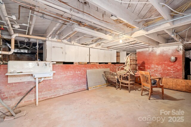 3515 Back Creek Church Rd, Charlotte, NC 28213 - unfinished basement with brick wall