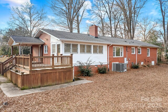 3515 Back Creek Church Rd, Charlotte, NC 28213 - rear view of house with central AC unit, a chimney, crawl space, a wooden deck, and roof with shingles