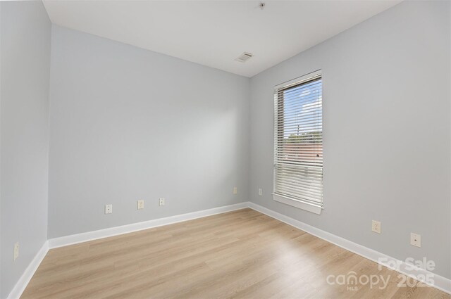 411 W Washington St, Greensboro, NC 27401 - unfurnished room with light wood-type flooring and baseboards