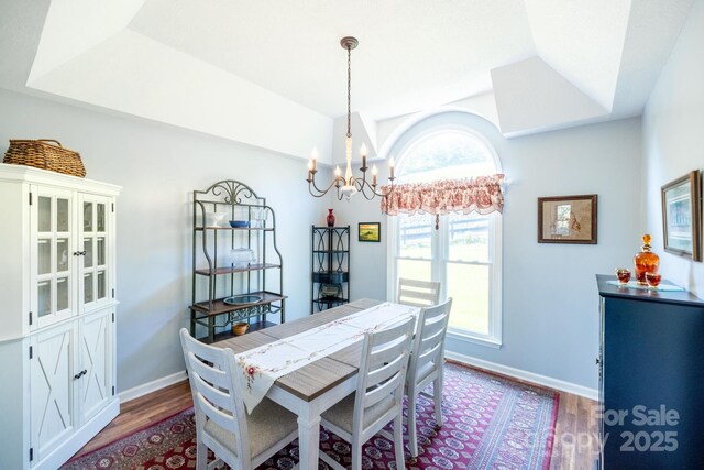 347 Hickory Mountain Rd, Sparta, NC 28675 - dining space with a chandelier, wood finished floors, lofted ceiling, and baseboards
