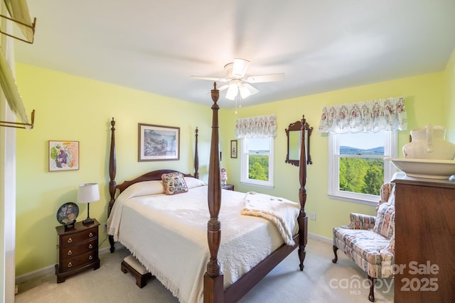 347 Hickory Mountain Rd, Sparta, NC 28675 - bedroom featuring light carpet, baseboards, and a ceiling fan