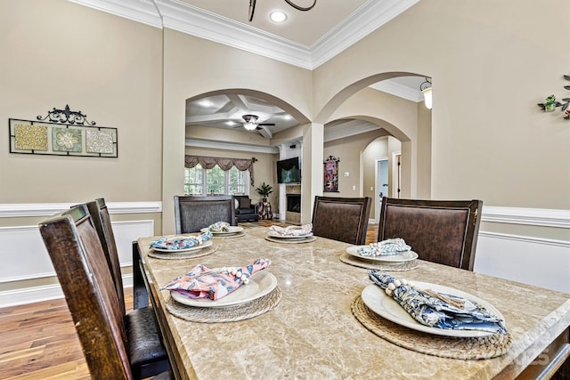 1616 Indian Springs Dr NW, Conover, NC 28613 - dining room with arched walkways, crown molding, a ceiling fan, wood finished floors, and recessed lighting