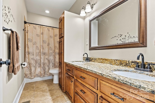 1616 Indian Springs Dr NW, Conover, NC 28613 - bathroom with double vanity, toilet, and baseboards