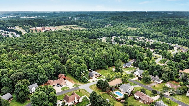 1616 Indian Springs Dr NW, Conover, NC 28613 - aerial view of residential area featuring a heavily wooded area and property parcel outlined