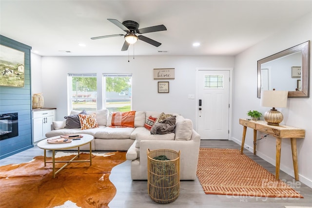 2116 Eastway Dr, Charlotte, NC 28205 - living room featuring healthy amount of natural light, a ceiling fan, recessed lighting, wood finished floors, and baseboards