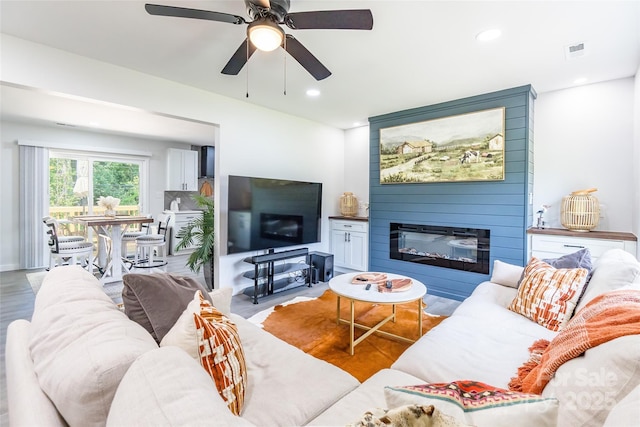 2116 Eastway Dr, Charlotte, NC 28205 - living room with a fireplace, a ceiling fan, and recessed lighting