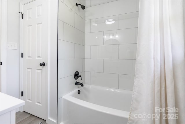 2116 Eastway Dr, Charlotte, NC 28205 - bathroom with shower / tub combo with curtain and wood finished floors