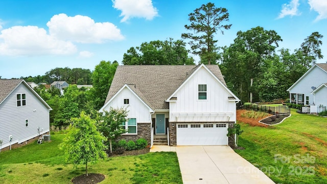 18619 Mainsail Ct, Lancaster, SC 29720 - view of front of home with board and batten siding, a garage, driveway, and a front yard