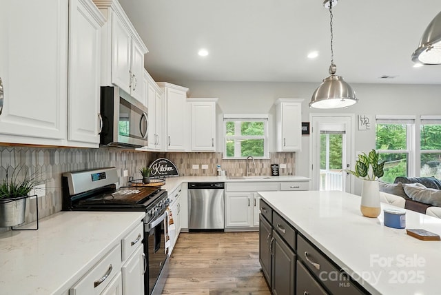 18619 Mainsail Ct, Lancaster, SC 29720 - kitchen featuring stainless steel appliances, a sink, white cabinetry, plenty of natural light, and recessed lighting