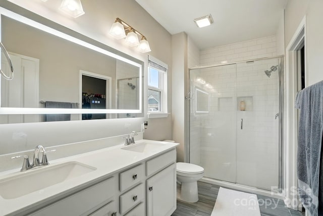 18619 Mainsail Ct, Lancaster, SC 29720 - full bathroom featuring a shower stall, double vanity, toilet, and wood finished floors