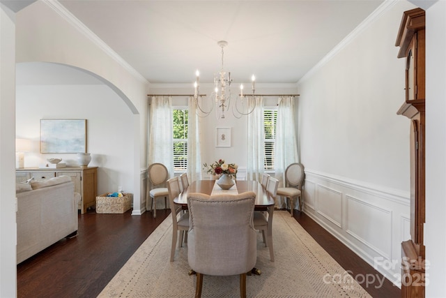 17637 Snug Harbor Rd, Charlotte, NC 28278 - dining space with dark wood-style flooring, a chandelier, arched walkways, crown molding, and wainscoting