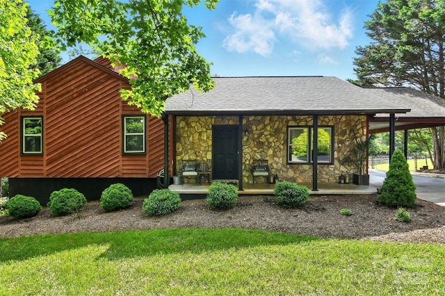 5378 Westwood Dr, Granite Falls, NC 28630 - view of front of property with stone siding, covered porch, an attached carport, and a front yard