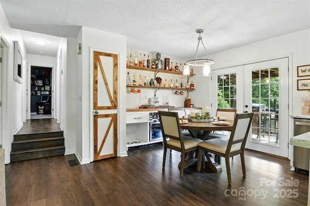 5378 Westwood Dr, Granite Falls, NC 28630 - dining room featuring dark wood-style flooring, french doors, and bar