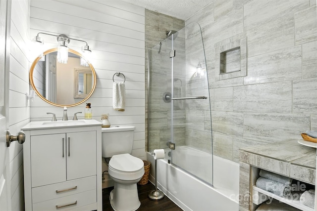 5378 Westwood Dr, Granite Falls, NC 28630 - bathroom featuring vanity, shower / bath combination with glass door, and wood finished floors