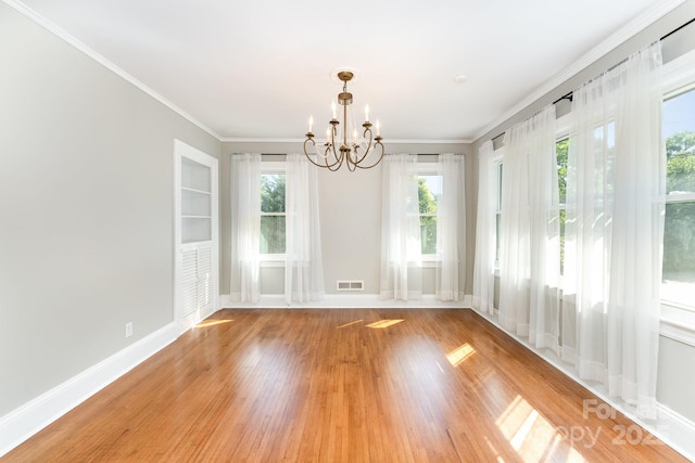1107 Fairfield Dr, Gastonia, NC 28054 - unfurnished room featuring a chandelier, light wood finished floors, crown molding, and baseboards