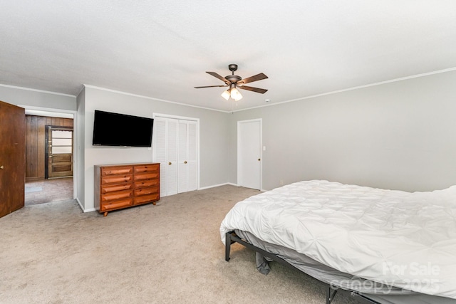 1107 Fairfield Dr, Gastonia, NC 28054 - bedroom with carpet floors, ornamental molding, a closet, a ceiling fan, and baseboards