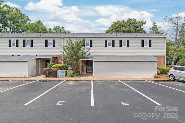 5949 Quail Hollow Rd Unit E, Charlotte, NC 28210 - townhome / multi-family property featuring brick siding and uncovered parking
