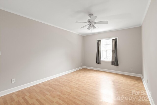 5949 Quail Hollow Rd Unit E, Charlotte, NC 28210 - unfurnished room featuring ceiling fan, ornamental molding, light wood-style flooring, and baseboards