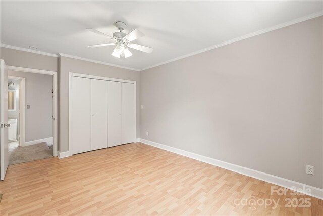 5949 Quail Hollow Rd Unit E, Charlotte, NC 28210 - unfurnished bedroom featuring light wood finished floors, baseboards, a closet, and ornamental molding