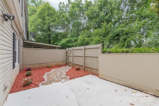 5949 Quail Hollow Rd Unit E, Charlotte, NC 28210 - view of yard featuring a patio area and view of wooded area