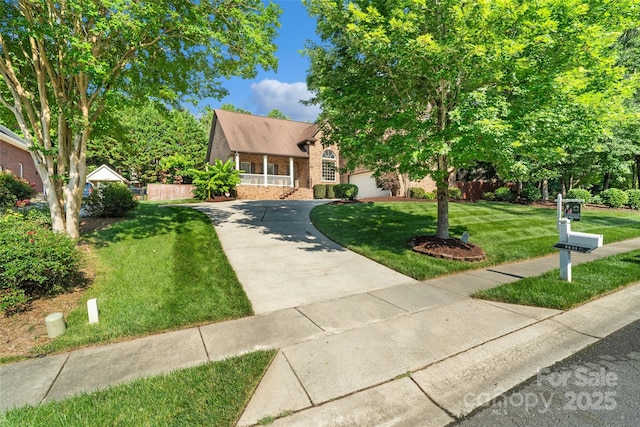 3831 Riceland Pl, Charlotte, NC 28216 - view of front facade featuring brick siding, concrete driveway, and a garage
