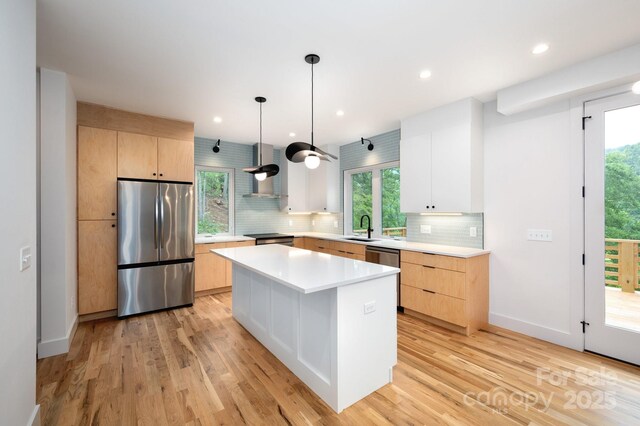 33 Windago Rd, Weaverville, NC 28787 - kitchen featuring stainless steel appliances, a sink, wall chimney range hood, light brown cabinetry, and recessed lighting