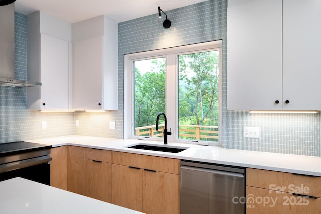 33 Windago Rd, Weaverville, NC 28787 - kitchen with stainless steel appliances, a sink, wall chimney exhaust hood, light countertops, and decorative backsplash
