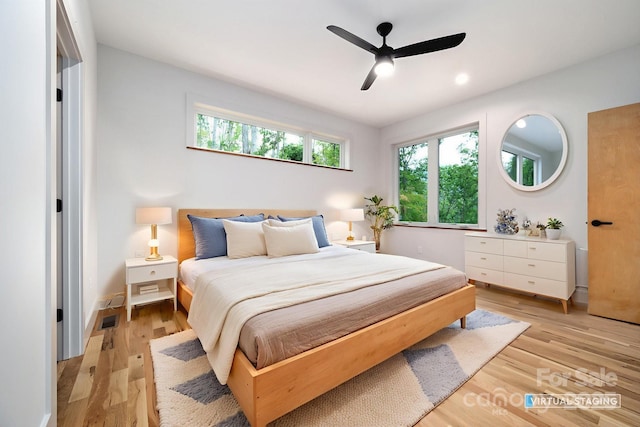 33 Windago Rd, Weaverville, NC 28787 - bedroom featuring multiple windows, light wood-type flooring, and a ceiling fan