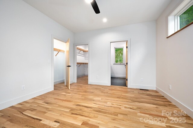 33 Windago Rd, Weaverville, NC 28787 - unfurnished bedroom featuring light wood-type flooring, baseboards, and ceiling fan