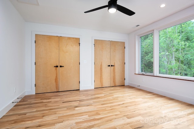33 Windago Rd, Weaverville, NC 28787 - unfurnished bedroom with multiple closets, light wood-type flooring, ceiling fan, recessed lighting, and baseboards