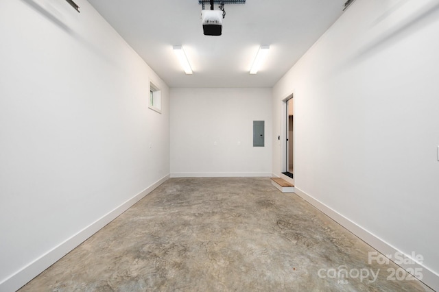 33 Windago Rd, Weaverville, NC 28787 - garage featuring electric panel, a garage door opener, and baseboards