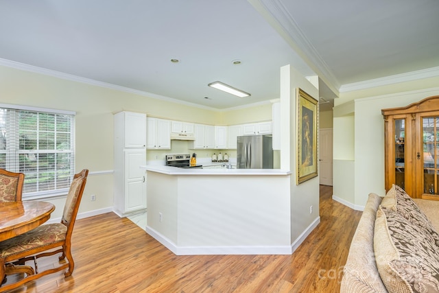 13402 Mccoy Rd, Huntersville, NC 28078 - kitchen featuring stainless steel appliances, under cabinet range hood, ornamental molding, light wood-type flooring, and white cabinets