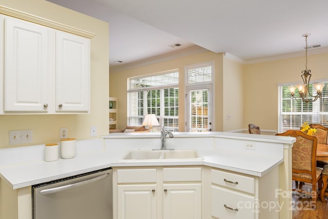 13402 Mccoy Rd, Huntersville, NC 28078 - kitchen with stainless steel dishwasher, ornamental molding, a chandelier, a peninsula, and decorative light fixtures