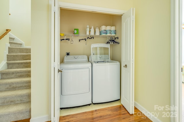 13402 Mccoy Rd, Huntersville, NC 28078 - washroom with washer and dryer and light wood-style floors