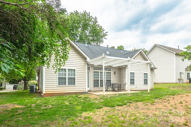 13402 Mccoy Rd, Huntersville, NC 28078 - back of house featuring a pergola, a patio, and a lawn