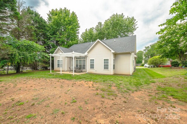 13402 Mccoy Rd, Huntersville, NC 28078 - back of property featuring a patio area, a yard, and roof with shingles