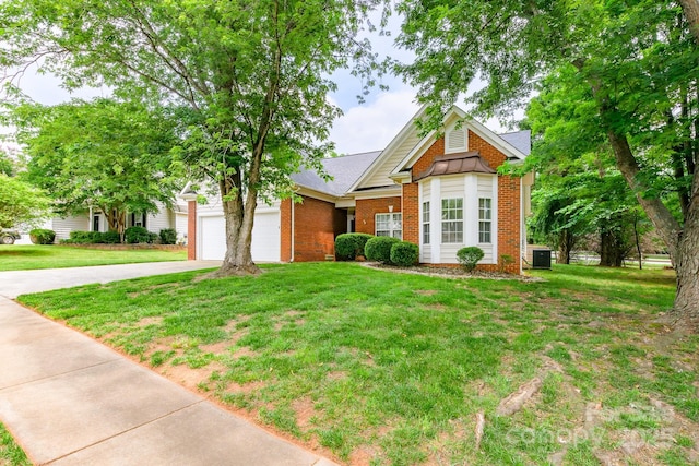 13402 Mccoy Rd, Huntersville, NC 28078 - view of front of home with driveway, brick siding, a front yard, and a garage