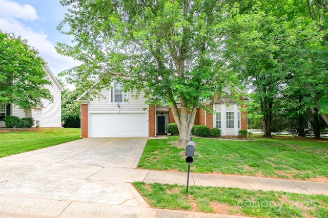 13402 Mccoy Rd, Huntersville, NC 28078 - obstructed view of property with brick siding, a garage, driveway, and a front yard
