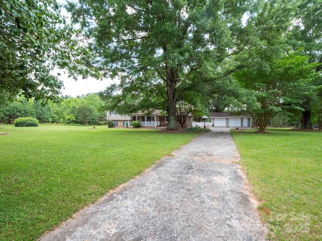 409 Ridge Rd, Clover, SC 29710 - ranch-style home with a front lawn, covered porch, and a garage